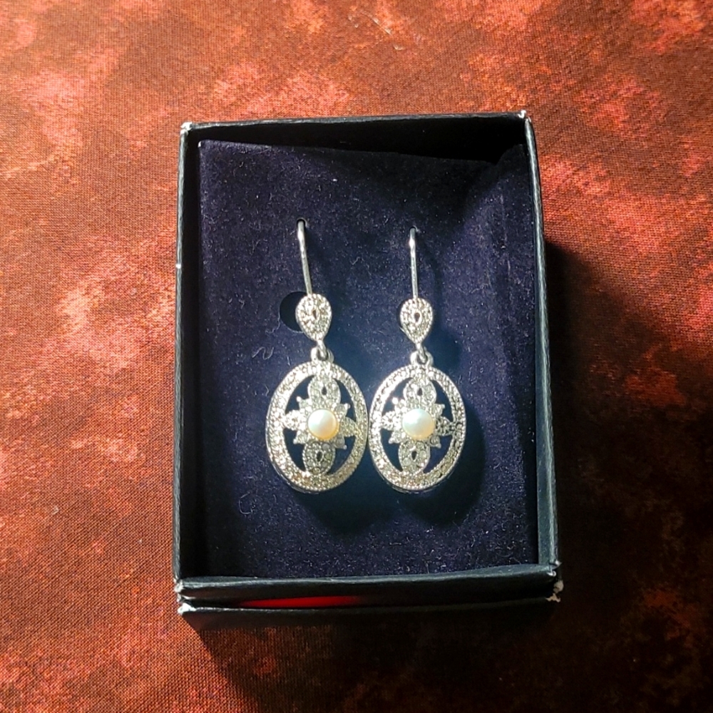 Silver and Pearl leverback earrings. Avon?